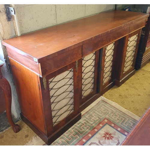 777 - A 19th Century four door Mahogany side Cabinet with Brass grilled and pleated material panelled Door... 