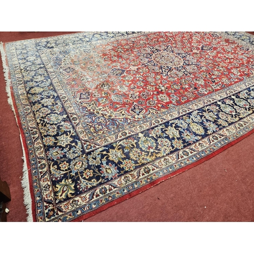 376 - A large Persian red ground Carpet with multi borders and central medallion design 390 x 297cm approx... 