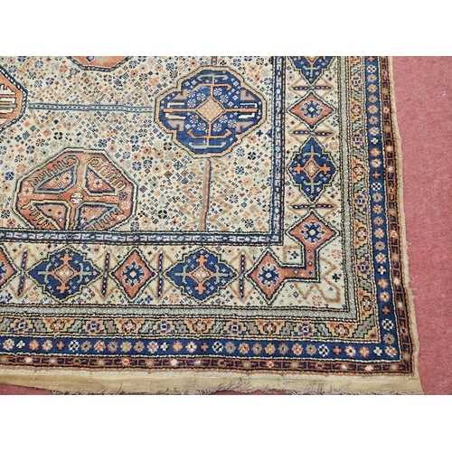 673 - A large cream ground Carpet with multi borders and repeating central pattern design. 325 x 318 cm ap... 