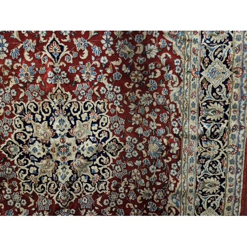 948 - A large Persian Carpet with multi borders and all over decoration with centre medallion design. 265 ... 