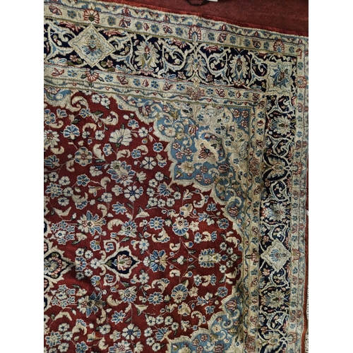 948 - A large Persian Carpet with multi borders and all over decoration with centre medallion design. 265 ... 