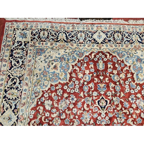 948 - A large Persian Carpet with multi borders and all over decoration with centre medallion design. 265 ... 