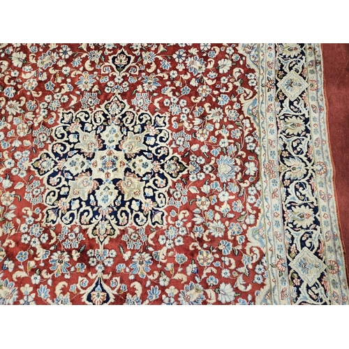 948 - A large Persian Carpet with multi borders and all over decoration with centre medallion design. 265 ... 