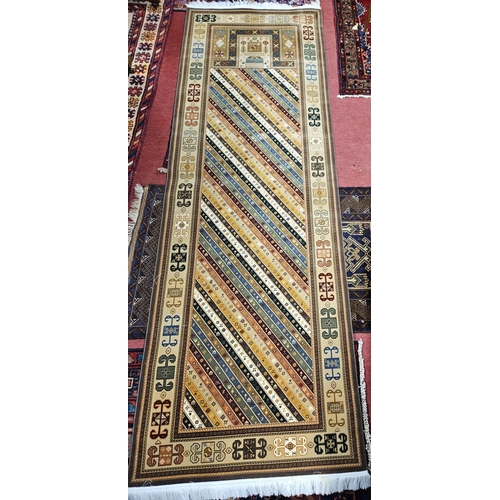 814 - A very fine woven full pile Iranian Runner with multi coloured modern look field. 310 x 100cm approx... 