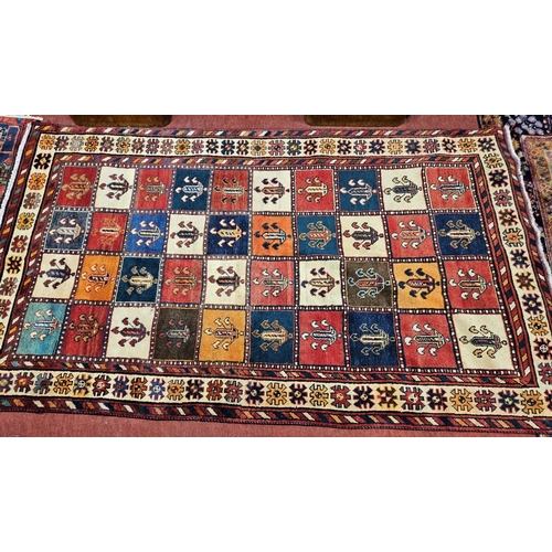 922 - A thick pile Persian Bactria Carpet with a traditional Persian panel design. 260 x 154 cm approx.