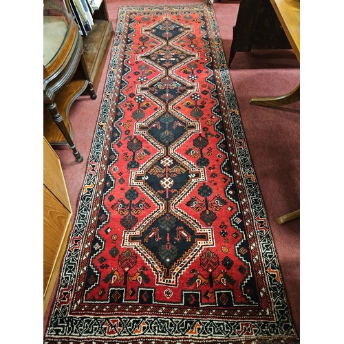 561 - A unique Persian Qashqai nomadic runner with Red ground and a cross door medallion design. 205 x 100... 