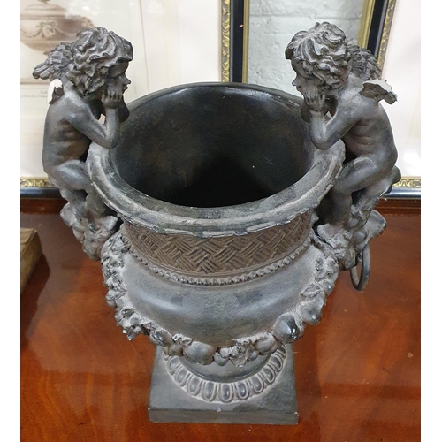 804 - A centre piece Bowl with Cherub lifting handles.
H 34 x 25 x 20 cm approx.