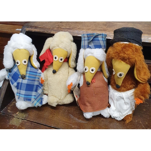 837 - A quantity of Porcelain dolls heads along with a quantity of Wombles.