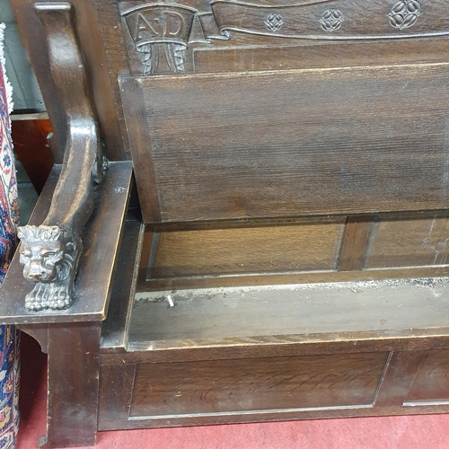 849 - A Rare early 20th Century Oak hall Bench of large size with lift up seat, made for Thornhill House S... 