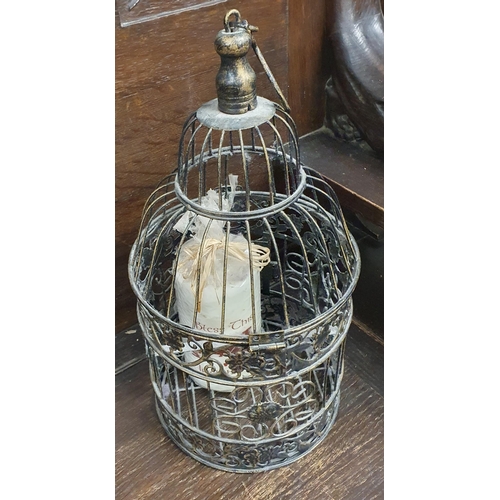 851 - A 20th Century oval Mirror with etched edging along with a birdcage candle holder and a tin.
50 x 40... 