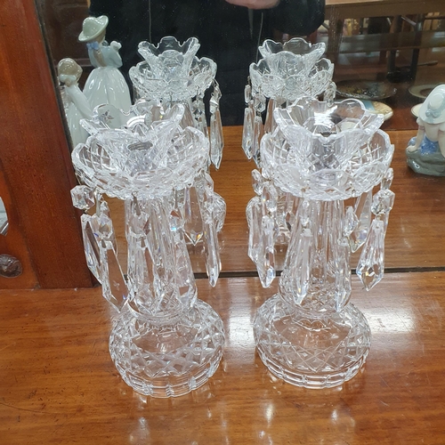 861 - A good pair of Waterford Crystal Candlesticks with crystal drops. H 26 cm approx.