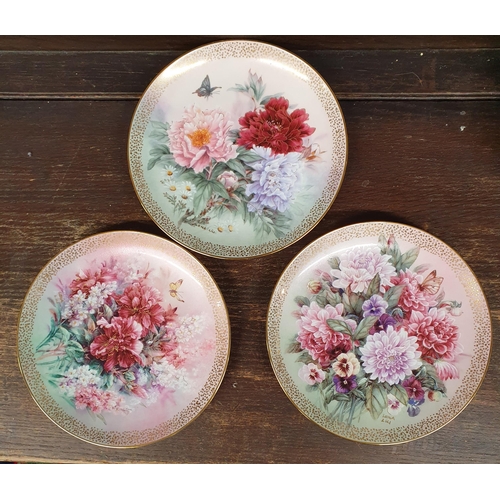 867 - A large group of Collectors Plates. A set of eight and a set of four depicting flowers. D 21 cm appr... 