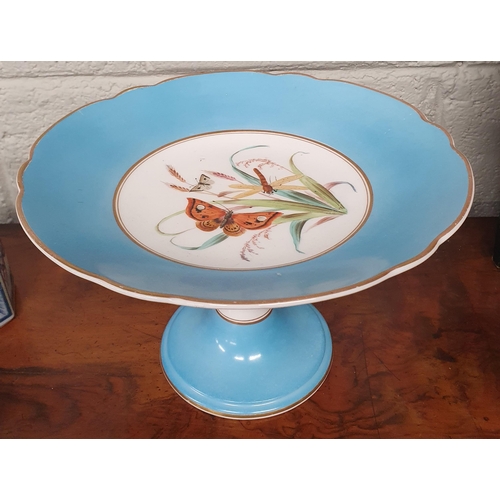 871 - A good 19th Century Porcelain Tazza with turquoise ground hand painted centre depicting butterflies ... 