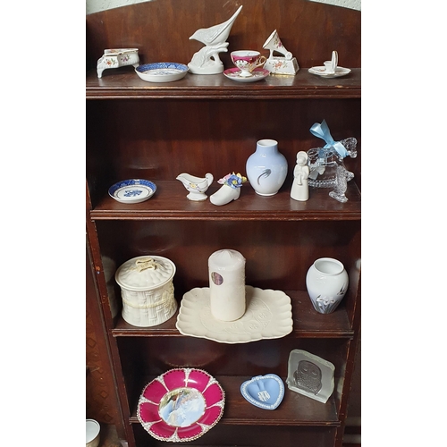 877 - A good quantity of Decorative Items on three shelves to include Belleek, Royal Copenhagen, Royal Dou... 