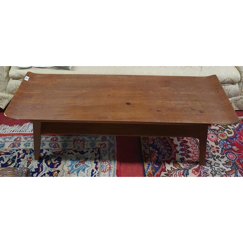 918 - A mid Century Mahogany Coffee Table with raised ends. 113 x 38 x H 36 cm approx.