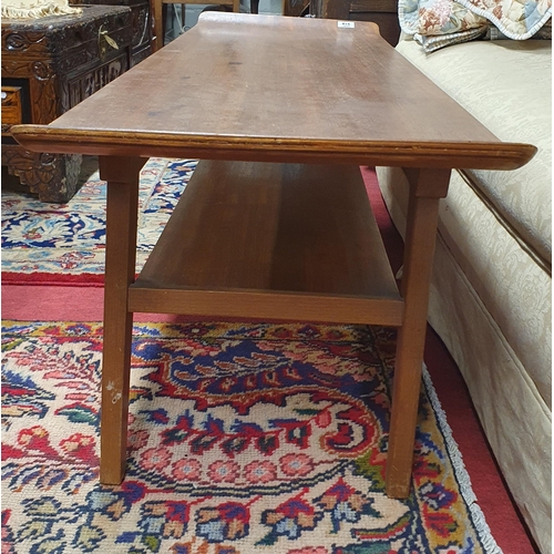 918 - A mid Century Mahogany Coffee Table with raised ends. 113 x 38 x H 36 cm approx.