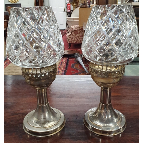 931 - An interesting pair of early 20th Century oil Lamps with later crystal Shades.