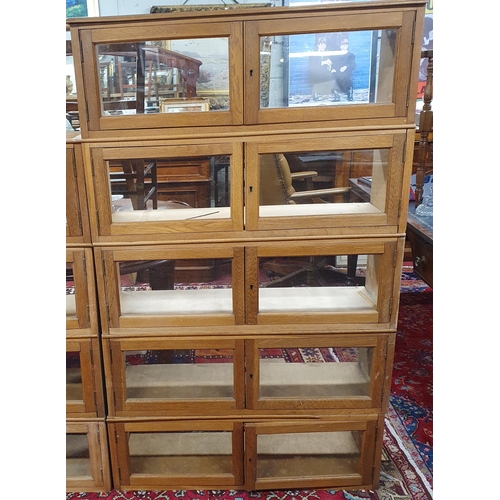 941 - A large collection of Oak Haberdashery style stacking Cabinets. Each unit 91 x 27 x H 31 cm approx.