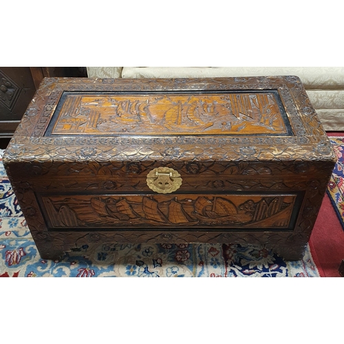 947 - Two Oriental Camphorwood Chests with highly carved outline. 69 x 34 x H 35, 42 x 88 x H 47 cm approx... 