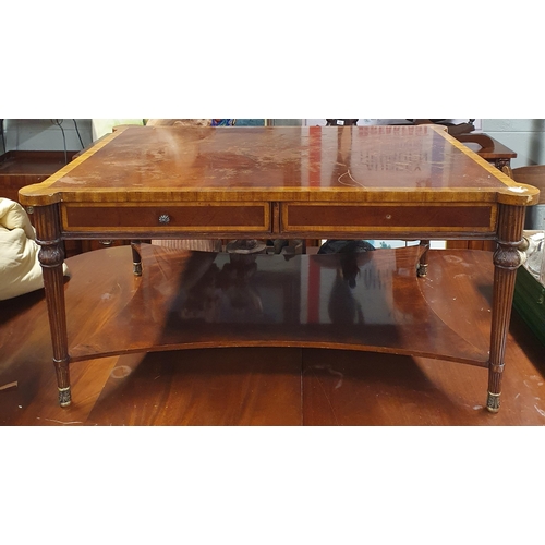 952 - A modern Mahogany and veneered coffee Table on turned reeded supports and platform base(needs repair... 