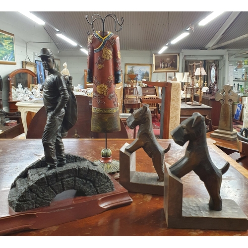 953 - A quantity of Timber Carvings to include Dolphins, Bookends in the form of dogs, a wig Stand along w... 