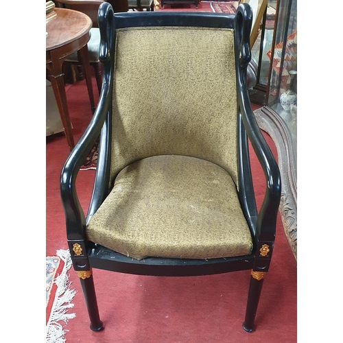 959 - A good ebonised Tub Chair along with a painted magazine Rack. W 58 x SH 40 x BH 94 cm approx.