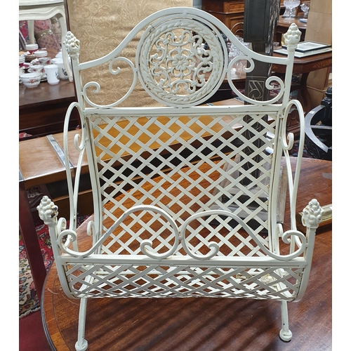 959 - A good ebonised Tub Chair along with a painted magazine Rack. W 58 x SH 40 x BH 94 cm approx.