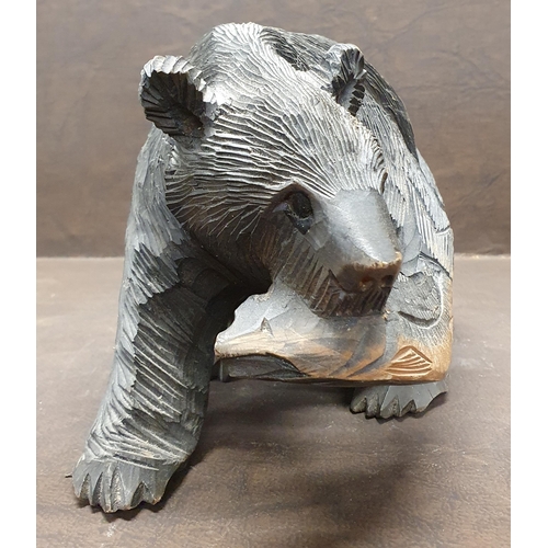 1034 - An early 20th Century Japanese carved Bear with salmon. Feet inscribed with signature. 25 x 15 cm ap... 