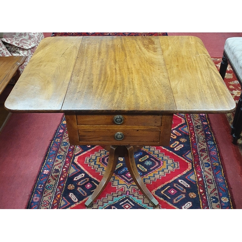 1088 - A good Regency Mahogany Side Table with drop flaps and twin frieze drawers on quatrefoil splayed sup... 