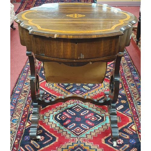 1107 - An early 19th Century Rosewood and Inlaid Work Table with single frieze drawer and lyre shape end su... 