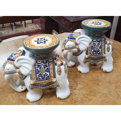 1116 - A good pair of Porcelain Stands depicting Elephants. H 28 cm approx.