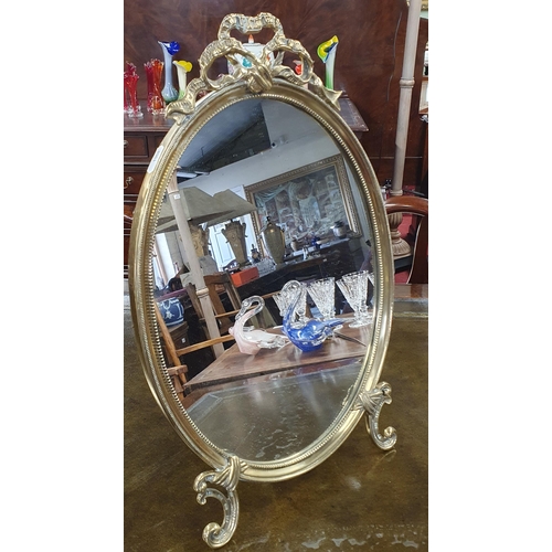 1129 - A really good early 20th Century Brass oval Vanity Mirror. H 47 x W 29 cm approx.