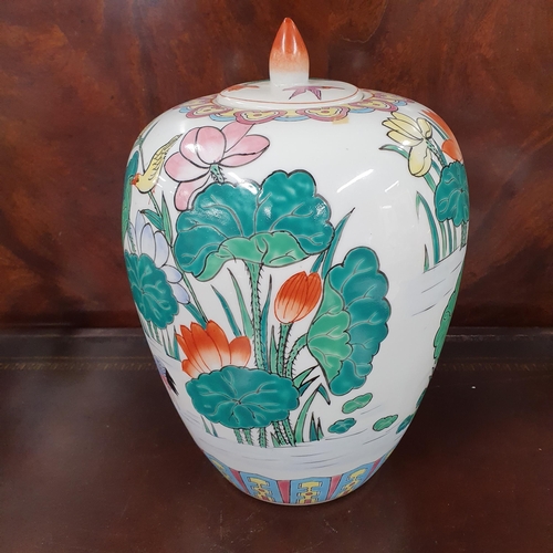 1139 - An Oriental Ginger Jar with hand painted decoration. H 30 x D 22 cm approx.