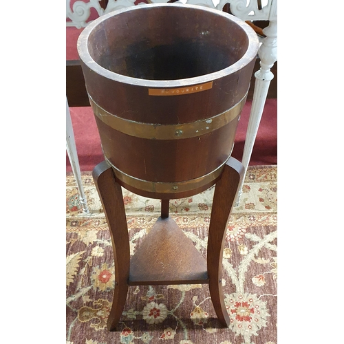 1148 - A good late 19th early 20th Century Planter on stand with brass banding. H 77 cm approx.