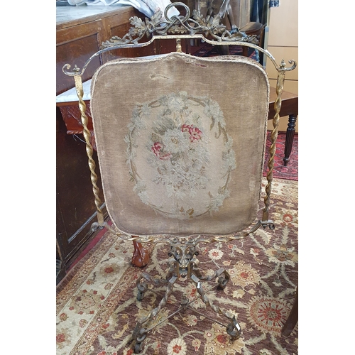 1157 - A 19th Century Metal Firescreen with distressed tapestry panel on a swivel movement.
H 107 x W 60 cm... 