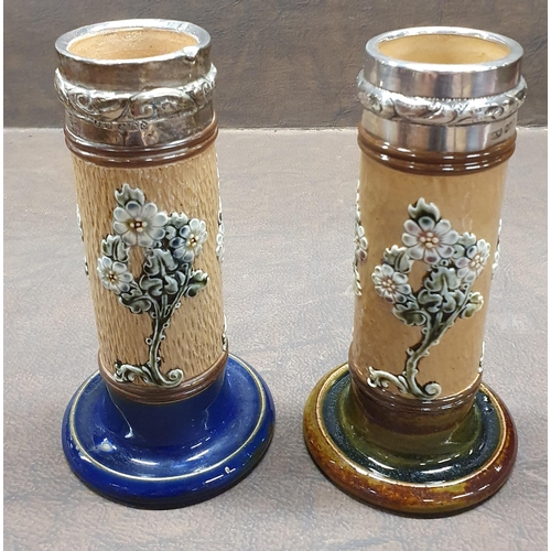 1171 - A pair of 19th Century Royal Doulton salt glaze Candlesticks with silvered rims. 
H 15 cm approx.