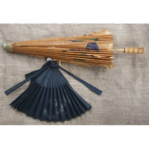 135 - A quantity of vintage Walking Sticks and Parasols.