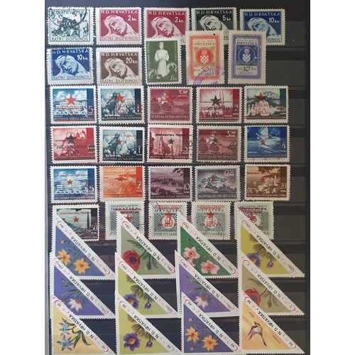 422 - A large collection of Yugoslavia and Albania Stamps.