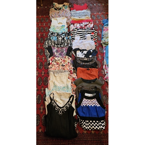 875 - A large quantity of ladies Dresses 30+. Size 8/12 approx. Please note no condition reports will be d... 