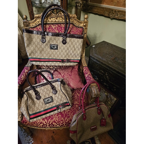 883 - Three Guess Vintage Handbags. Please note no condition reports will be done on this lot. We recommen... 