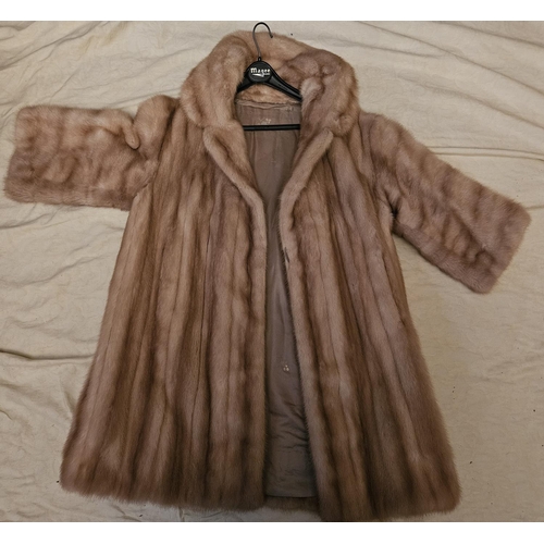 896 - A short Cream Mink fur Coat. Please note no condition reports will be done on this lot. We recommend... 