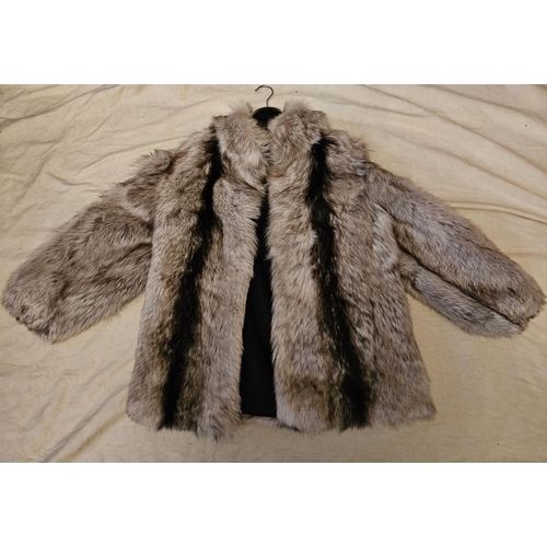 897 - A short striped fur Coat. Please note no condition reports will be done on this lot. We recommend yo... 