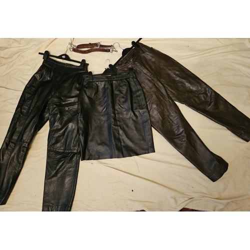 911 - Two leather Trousers, a leather Skirt and a belt. Please note no condition reports will be done on t... 