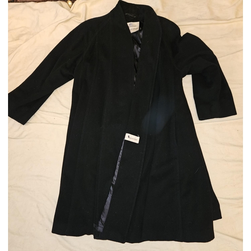 921 - A good Black Aquascutum full length Coat. Please note no condition reports will be done on this lot.... 