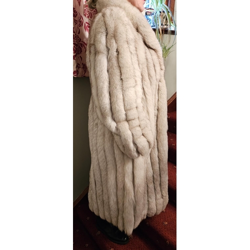 930 - A fabulous Silver Fox fur Coat. Please note no condition reports will be done on this lot. We recomm... 