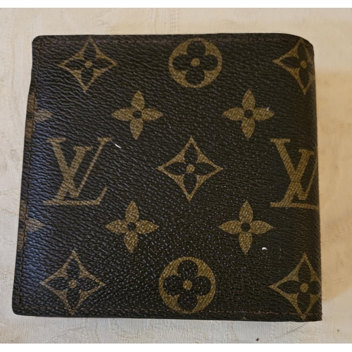 934 - A Louis Vuitton Wallet. Please note no condition reports will be done on this lot. We recommend you ... 