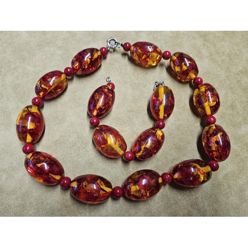 965 - A large Coral style Necklet and Bracelet along with another Ruby style Necklace.