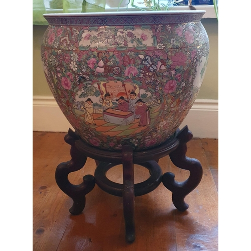 100 - An early Oriental hand painted Pot of large size on a hardwood stand. Diam. 36 x H 52 cm approx.