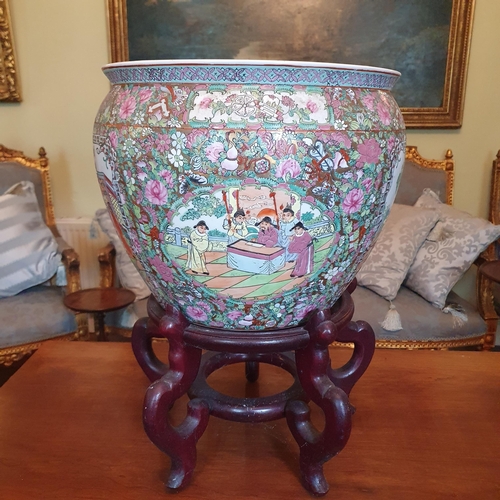 100 - An early Oriental hand painted Pot of large size on a hardwood stand. Diam. 36 x H 52 cm approx.