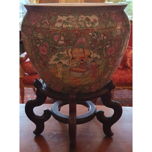 100 - An early Oriental hand painted Pot of large size on a hardwood stand. Diam. 36 x H 52 cm approx.